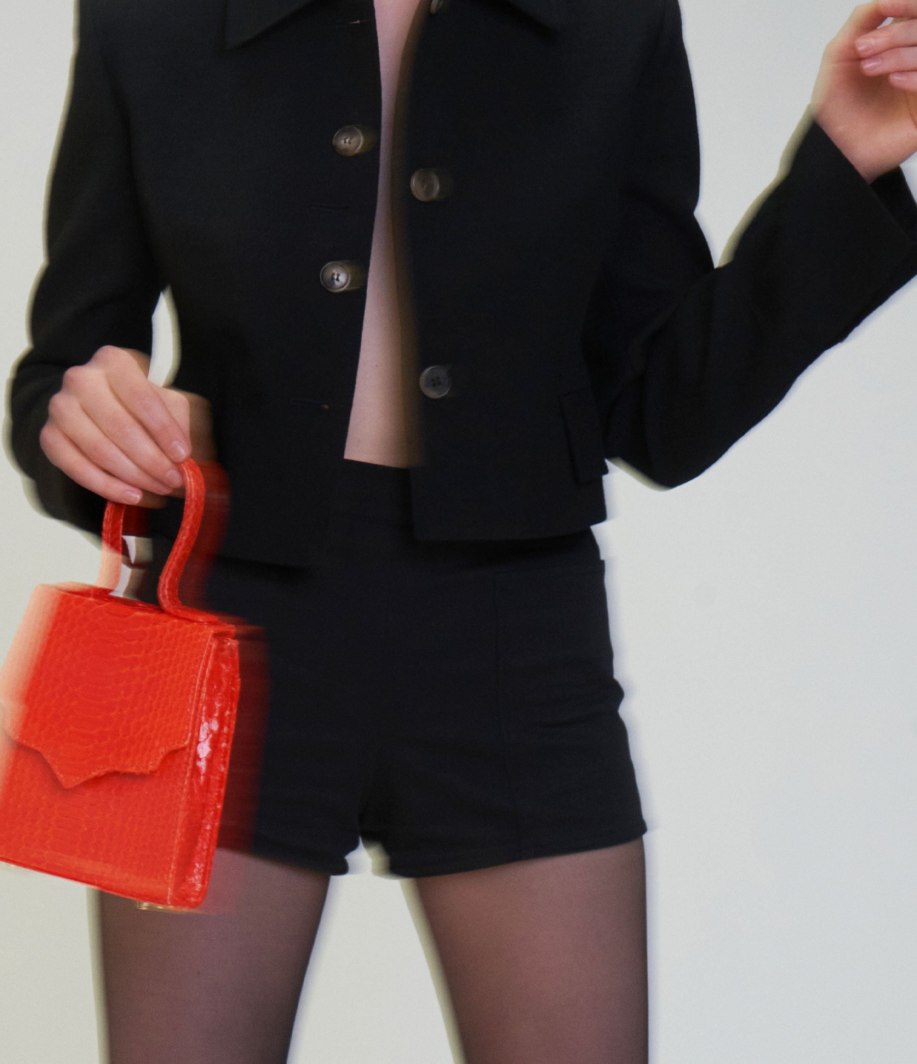 The Mini Missy in Hot Orange Python with Gold Hardware