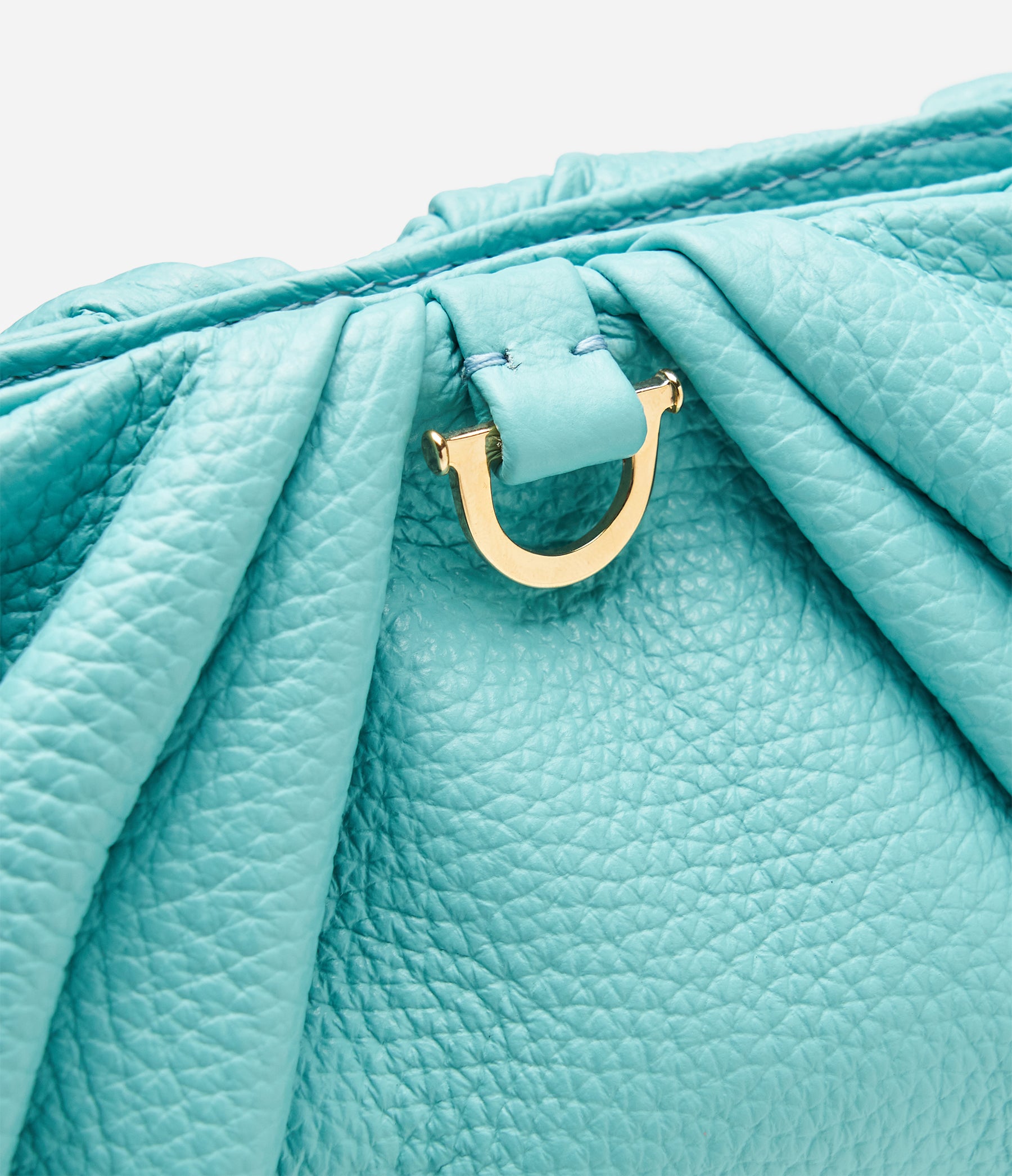 The Croissant in Lagoon Blue Leather with Gold Hardware