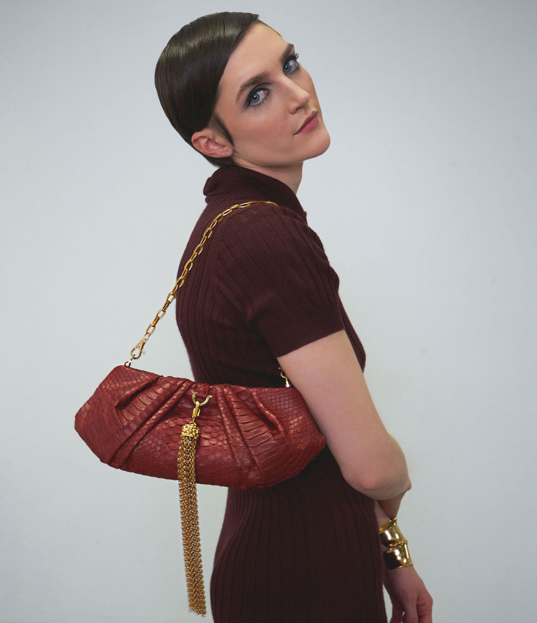 The Croissant in Oxblood Python with Gold Hardware
